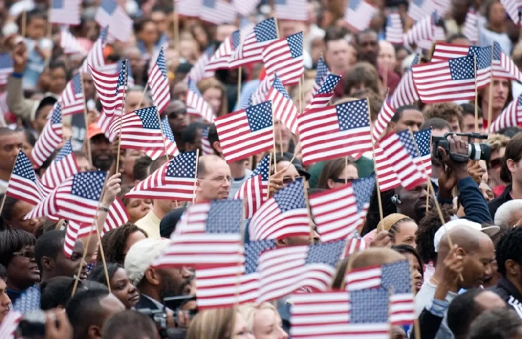 170404-F-ZZ999-001 A U.S. flag waving at a political rally during the 2025 presidential campaigns.