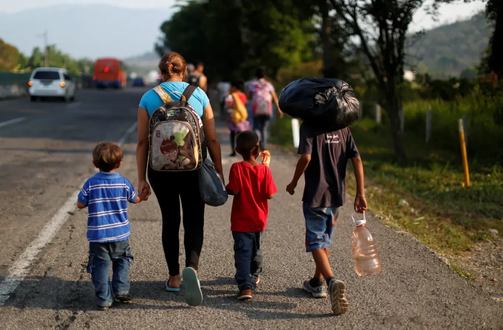 A family crossing the border, highlighting immigration debates in the 2025 campaigns.