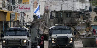 Breaking news text overlay with a world map background representing global events.