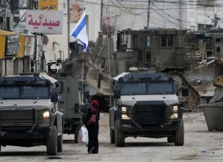 Breaking news text overlay with a world map background representing global events.