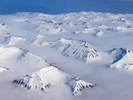 Aerial view of Greenland’s vast ice-covered landscape.
