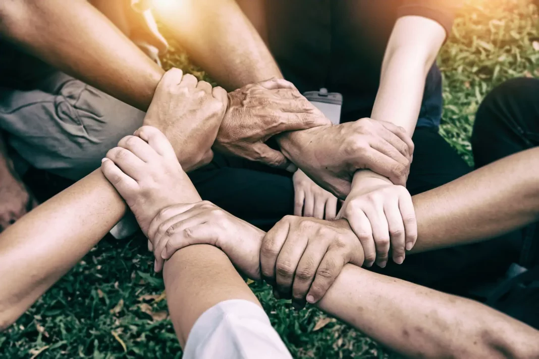 Human-Connection-v2 Hands holding together, symbolizing kindness and humanity.