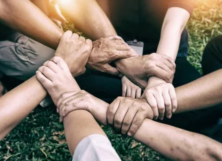 5 Heartwarming Viral Stories That Touched the World in 2025 Hands holding together, symbolizing kindness and humanity.