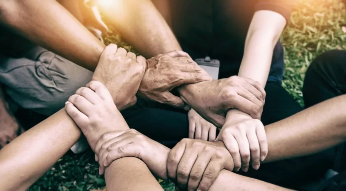 5 Heartwarming Viral Stories That Touched the World in 2025 Hands holding together, symbolizing kindness and humanity.