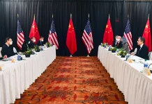 The Latest on U.S. and China Trade Negotiations: What You Need to Know Flags of the United States and China during trade talks.