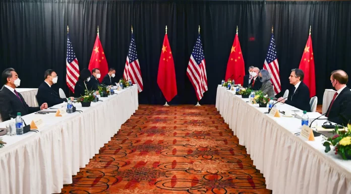The Latest on U.S. and China Trade Negotiations: What You Need to Know Flags of the United States and China during trade talks.