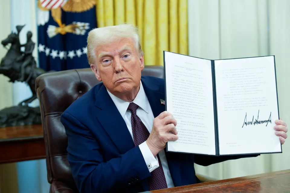 President Trump signing an executive order at the White House.