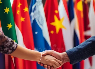Top 5 Diplomatic Events Shaping Global Politics in 2025 Diplomats shaking hands at an international summit representing global diplomacy.