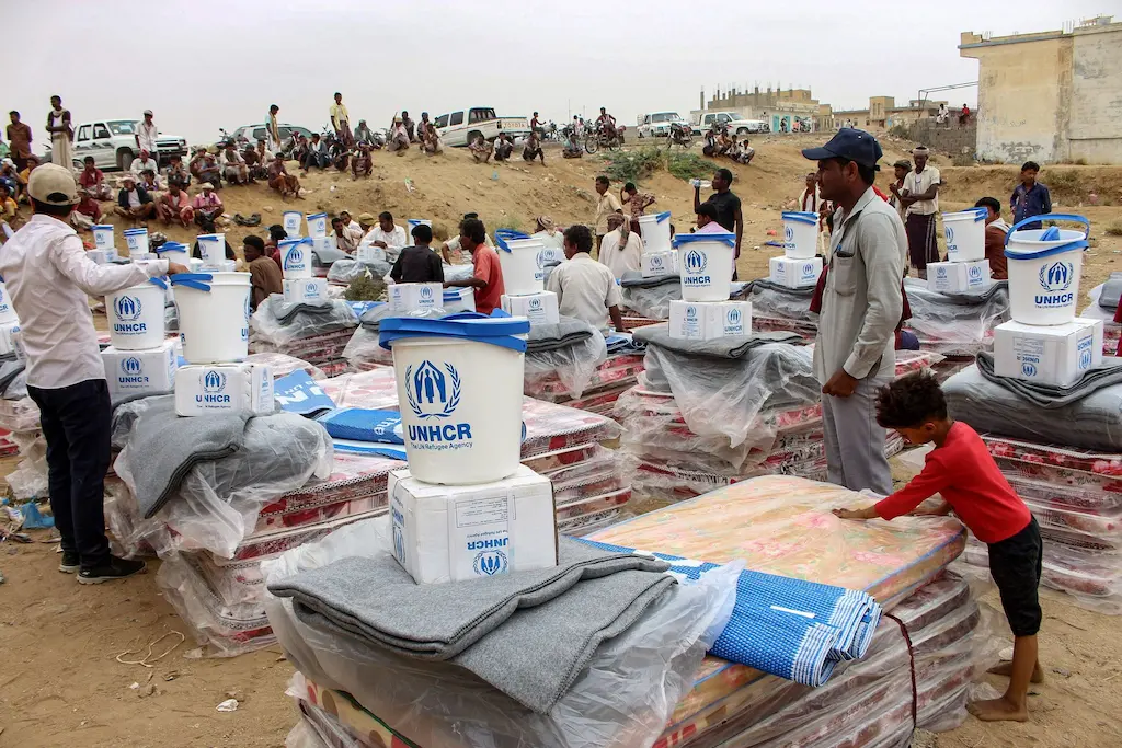 Humanitarian aid workers delivering food and supplies in Yemen.