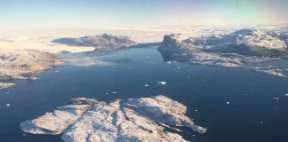 Aerial view of Greenland’s vast ice-covered landscape.