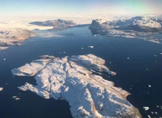 Trump Revives Demand to Buy Greenland in Contentious Call with Danish PM Aerial view of Greenland’s vast ice-covered landscape.