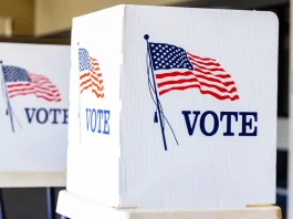 A voting booth representing the democratic process in the United States.