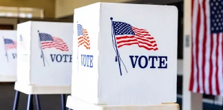 A voting booth representing the democratic process in the United States.