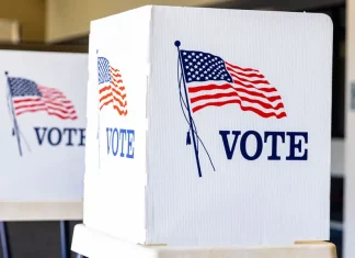 The Evolution of Voting Rights in the United States: A Historical Perspective A voting booth representing the democratic process in the United States.