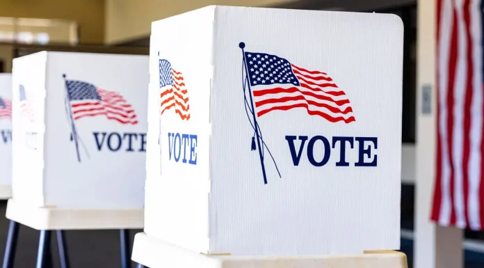 The Evolution of Voting Rights in the United States: A Historical Perspective A voting booth representing the democratic process in the United States.