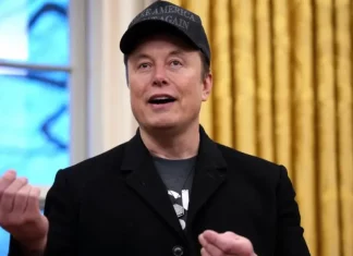 Author of Upcoming Elon Musk Biography Says ‘There Is No Evidence’ Billionaire Has Any ‘Intellectual Achievements’ Elon Musk speaking at a conference, looking serious.
