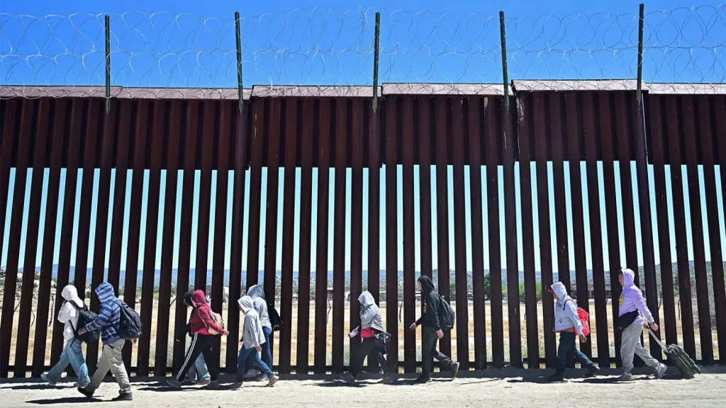 Migrants crossing the border in record numbers under Biden administration.