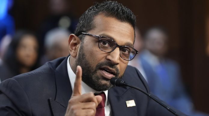 Kash Patel’s Foreign Business Ties Raise Questions as He Awaits FBI Confirmation Kash Patel speaking at a political event.