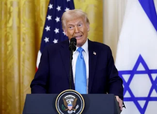 DESPERATE DEMS STRIKE AGAIN: Trump Faces Yet Another Bogus Impeachment Attempt! Donald Trump speaking at a rally, addressing impeachment attempts.