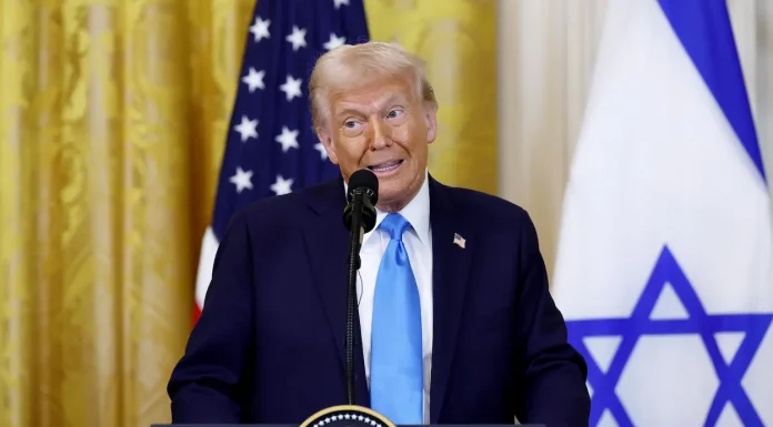 DESPERATE DEMS STRIKE AGAIN: Trump Faces Yet Another Bogus Impeachment Attempt! Donald Trump speaking at a rally, addressing impeachment attempts.