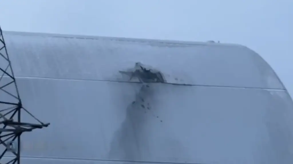 wmremove-transformed Chernobyl radiation shield after Russian drone strike.